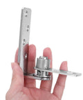 Person holding Stainless Steel Double Gate Hinges With Dual Direction Opening And Automatic Rebound For Cafe Saloon Doors And Cabinet Doors