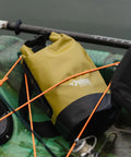 ExoDry 20L Dry Bag With Roll Top Closure, waterproof gear carrier on kayak, shows durable design and shoulder straps included