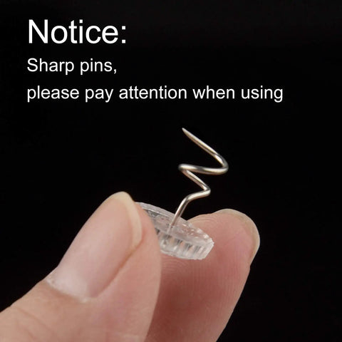 Kickass Upholstery Twist Pins Clear Heads 100 Piece Set showing sharp twist pin held between fingers for easy use.