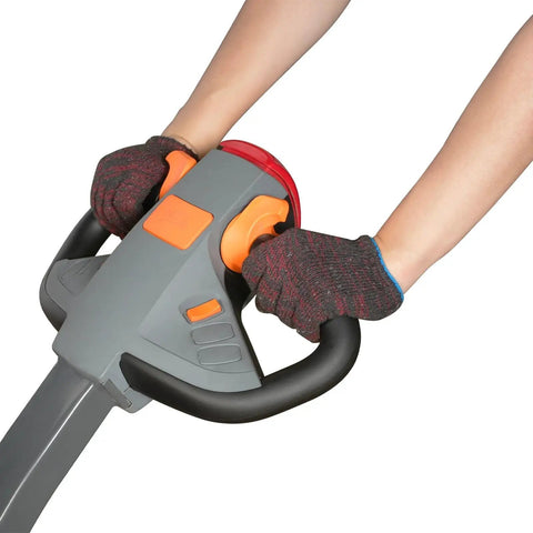 Hands gripping the controls of a Heavy Duty Electric Straddle Stacker 3300 Lb Capacity with ergonomic design.