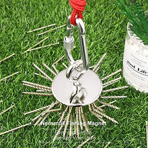 Front view of Neosmuk magnet fishing kit: round silver neodymium magnet with red rope and carabiner on grass.