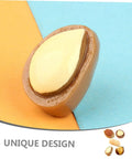 Close-up of a realistic resin nut from Twenty Piece Miniature Resin Nut Embellishments For Dollhouse Food Props on a colored background.