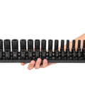 Hand holding Three Eighths Inch Drive Six Point Impact Socket Set With Rails Thirty Piece Shallow And Deep Sockets From Quarter Inch To One Inch