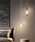 Nordic Minimalist Pendant Light With Crystal Glass Shade in bedroom setting, adjustable mini ball, modern metal base.