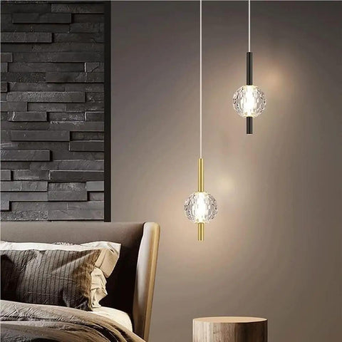 Nordic Minimalist Pendant Light With Crystal Glass Shade in bedroom setting, adjustable mini ball, modern metal base.