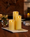 Cozy Flameless LED Candle With Moving Flame Pillar, Remote Ready And Timer, Battery Operated, Ivory Pillar on table