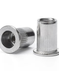 Top Shelf Heavy Duty 1/4 Inch 20 Thread Rivet Nuts, 100 Piece 304 Stainless Steel Flat Head Nutserts, Built Tough Corrosion Resistant Threaded Inserts For Garage And Mechanic Work, close-up of metallic rivet nuts.
