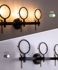 Three Light Vanity Light Fixture In Black Gold Finish With Seeded Glass Over Mirror Wall Sconces, on and off view, 25 inch long