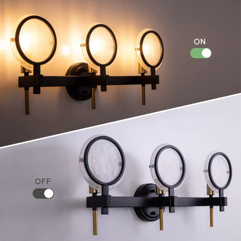 Three Light Vanity Light Fixture In Black Gold Finish With Seeded Glass Over Mirror Wall Sconces, on and off view, 25 inch long