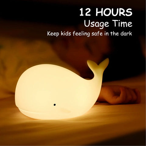 Under The Sea Nursery Night Light Whale Lamp For Baby And Toddler Room Soft Silicone Ocean Theme Nightlight shining beside sleeping child