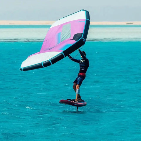 Person using Handheld Kitesurfing Kite 5 Square Meter Wing Foil Surge Wing With Two Window Design on water