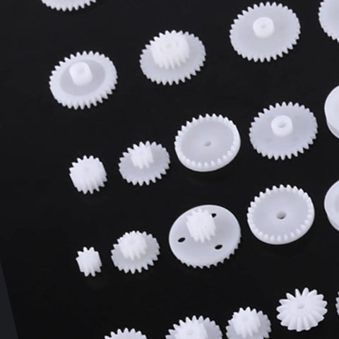 Durable Plastic Gear Kit Set For DIY Robots Cars And Tech Projects Includes 64 Wearable Crown Pulley Belt Gears Built Tough For Long Service Life Perfect For Creative Model Building And Mechanic Hobbyist Gadgets; white plastic gears on black