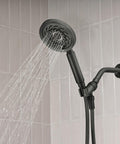 Neo Exhilaration High Pressure Handheld Shower Head With 2 GPM Flow Matte Black Adjustable Spray in use on tiled wall