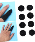 1000 Pack Antistatic Finger Cots Providing A No Sweat Grip That Shields Precise Electronics During Heavy Mechanic Work And Warehouse Tasks While Delivering Knockout Quality On A Tight Budget showing black latex finger cots on hand and flat.