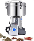 Electric Grain Grinder Mill For Coffee Beans Nuts Seeds Spices Herbs Pepper Cereal Wheat High Power Milling Machine With Stainless Steel Grinding Chamber Durable Powder Grinder For Home Kitchen Use. Stainless steel grinder on white background with grinding chamber.