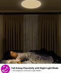 Dimmable Smart LED Ceiling Light Flush Mount 12 Inch 24W 3200 Lumens above a sleeping person in a dimly lit bedroom