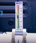 FlowRead R-320 Acrylic Flow Meter installed on 2-inch PVC pipe displaying 20 to 120 GPM range with easy-to-read UV scale.
