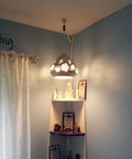 Crystal Plug In Pendant Light With 16.4 Ft Swag Cord, Dimmable Hanging Lamp illuminating a corner with white finish inside a room.