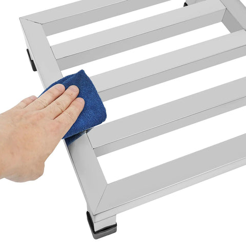 Cleaning the Stainless Steel Dunnage Rack Set 2 Pack 14x14x4 Inches Heavy Duty Floor Racks with a cloth, showing anti-slip footpads.