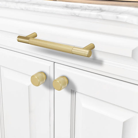 10 Pack 5 Inch Brushed Brass Knurled Cabinet Handles for Kitchen Cabinets Gold Pulls and Door Hardware installed on white cabinet