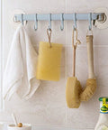 No Drill Hassle Self Adhesive Towel Rack Wall Mount Hook With Hella Strong Grip For Bathroom Kitchen And Living Room Totally Rad Space Saving Storage Solution Smooth Finish holding towels and sponges.