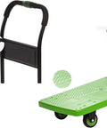 Heavy Duty Flatbed Hand Cart Featuring Slick Four Wheel Rollers And A Tough Foldable Frame showing handle and textured green base.