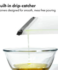 Two Piece Cutting Board Set For Kitchen Prep With One Small Prep Board And One Large Everyday Board dripping into bowl