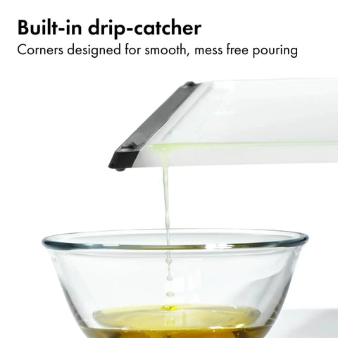 Two Piece Cutting Board Set For Kitchen Prep With One Small Prep Board And One Large Everyday Board dripping into bowl