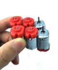 Six Pack DC Motors Kit For DIY Projects With Mini Electric Hobby Motors 3V To 12V Up To 25000 RPM shown in a hand