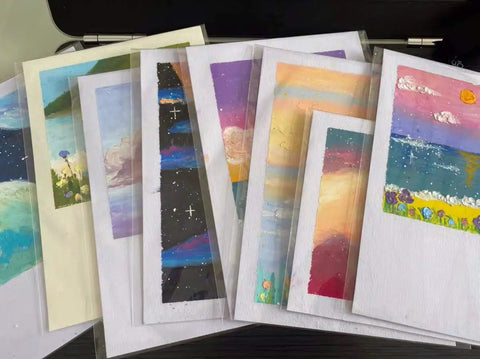 Ultra Clear 4-5/8 In By 5-3/4 In A2 Card Sleeves Resealable Cellophane Bags Self Adhesive Closure Fits A2 Envelopes Great For Photos Jewelry Candy Treats Cookies 200 Count holding colorful art prints