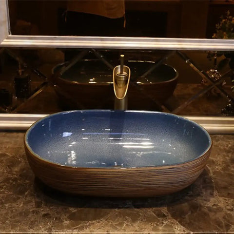 USZWBY Vessel Sinks Bathroom Vessel Sink Oval Ceramic Washbasin Vintage Art Countertop Basin Utensils with Faucet Bathroom Bowl Sink on marble vanity.