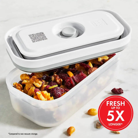 Fresh And Save Handheld Vacuum Sealer Kit with 3-piece BPA-free food storage container filled with nuts and berries.