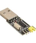 Close-up of USB To TTL Programmer Cable For STC Microcontrollers, showing USB connector and electronic components on board.