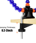 No Sweat Hella Solid Third Hand Soldering Helper With Four Bendable Upright Arms attached to wood with adjustable clamp.