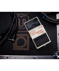 Compact Chromatic Tuner Pedal for Guitar and Bass with 21-Segment LED Meter placed on a stage-ready setup.