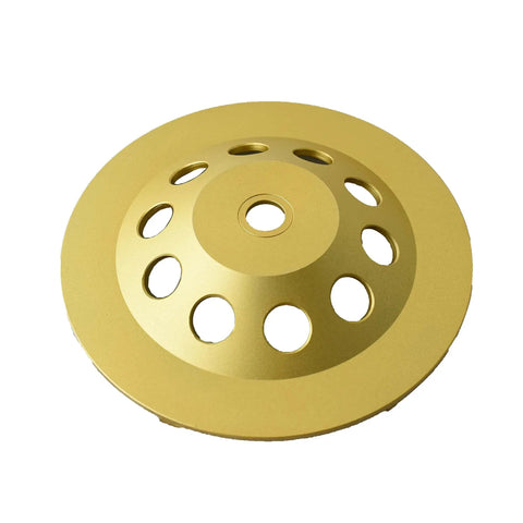 7 Inch Double Row PCD Cup Wheel Set For Beastly Concrete Coatings Removal And Surface Prep Remove Epoxy Mastic Glue Stucco Thinset Grout Mortar And Carpet Adhesives 12 Piece Non Threaded Shank 7/8 To 5/8 Inch, close-up view of gold wheel with central hole and circular cut-outs