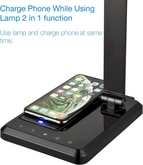 LED Desk Lamp With Wireless Charger And USB Port, black finish, with smartphone charging, shown with touch control panel