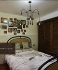 Kick Up Your Style With Adjustable Height Retractable Pulley System Vintage Black Metal Chandelier Ceiling Lamp Kitchen Bar Rack Built Tough Real Deal Quality hanging above a bed in a cozy bedroom.