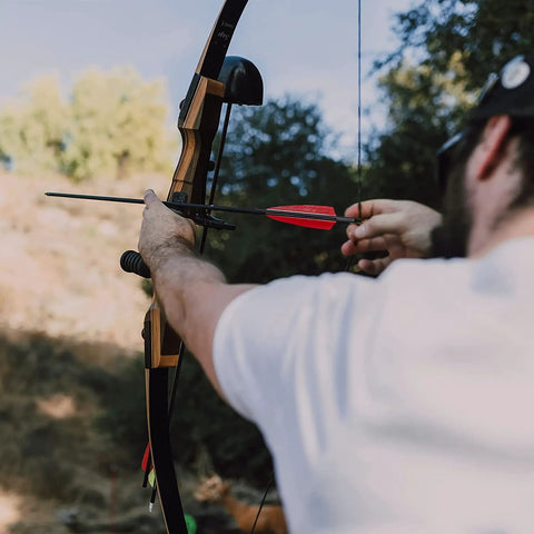 Archer using Beefed Up 30 Inch Carbon Hunting Arrows With Real Turkey Feather Fletching And Removable Tips, 100 Grain Arrowheads, 500 Spine