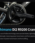 Close-up of Shimano Di2 R9200 crank on Di2 Full Carbon Road Bike With Ultra Light Frame And 24 Speed Shimano R9270 Groupset Hydraulic Disc Brakes Pro Grade Racing Carbon Bicycle For Adults Ultra Stiff Climb Ready 50cm Black.