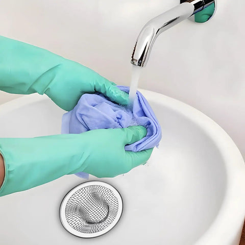 Person wearing green gloves washing a cloth near 100 Pack Stainless Steel Sink Drain Strainers For Bathroom And Kitchen With 2 Inch Top Mesh Catcher To Block Clogs Easy Install Heavy Duty Plumbing Filter Every Home Owner Gotta Grab.
