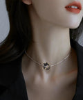 Model wearing necklace with small 3D alloy crown charm, ideal for DIY jewelry making, showcasing 120 pcs mini crown charms 3D alloy king crown beads bulk large hole spacer beads for jewelry making DIY craft bracelet necklace supplies bling ready for bead artists and DIY jewelry lovers ideal for craft projects and jewelry making on the regular.