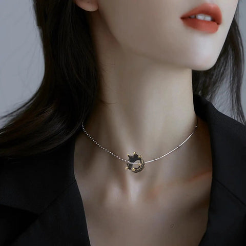 Model wearing necklace with small 3D alloy crown charm, ideal for DIY jewelry making, showcasing 120 pcs mini crown charms 3D alloy king crown beads bulk large hole spacer beads for jewelry making DIY craft bracelet necklace supplies bling ready for bead artists and DIY jewelry lovers ideal for craft projects and jewelry making on the regular.