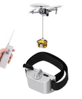 All Terrain Drone Airdrop System With Remote Release For Payload Delivery Across Mavic Mini 4 Pro shown with remote and payload.