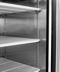 Interior view of Kickass Heavy Duty Two Door Reach In Commercial Freezer All Stainless Steel with shelves.
