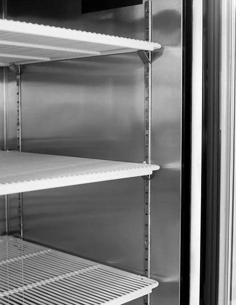 Interior view of Kickass Heavy Duty Two Door Reach In Commercial Freezer All Stainless Steel with shelves.