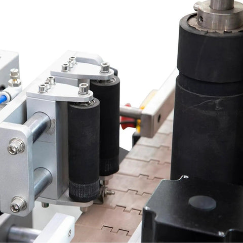 WZLOIUNHZ Automatic Positioning Labeler For Round Bottles Cans Jars Servo Control Smooth Wrap With 10 To 180 Mm Height Range Professional Precision Application Machine close-up of rollers and mechanism.