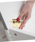 Close-up of gold Mobestech semi-hidden spring-loaded cabinet hinge for RV/camper during installation