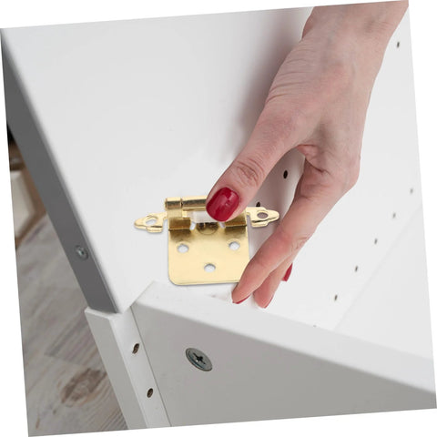 Close-up of gold Mobestech semi-hidden spring-loaded cabinet hinge for RV/camper during installation