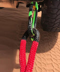 Heavy Duty Three Eighth Inch Synthetic Shackle NexGen PRO Gator Jaw in red and black attached to a vehicle for towing.